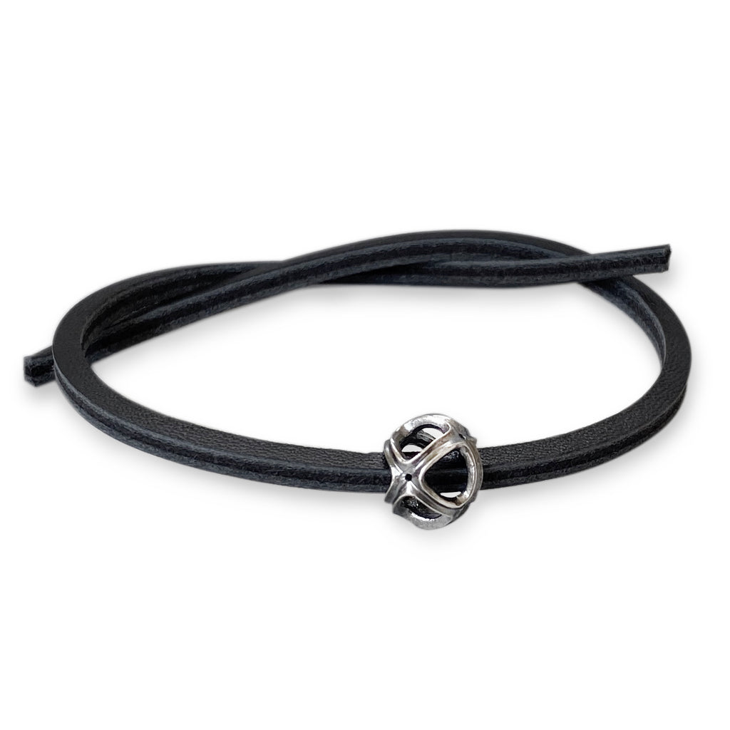 Black leather bracelet with golden clasp -